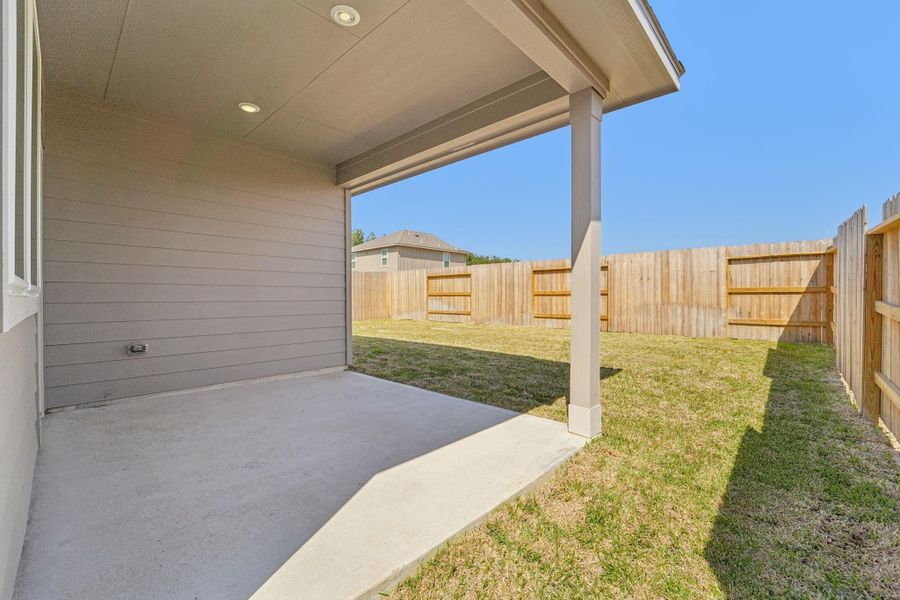 Exterior details and patio area of a home in Landing Meadows - Traditional Series, New Caney (Image 3).