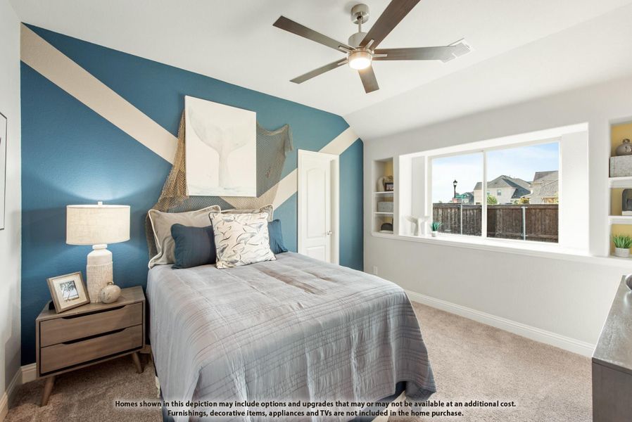 Bedroom with blue geometric accent wall, ceiling fan, carpet, and large window with built-in shelves