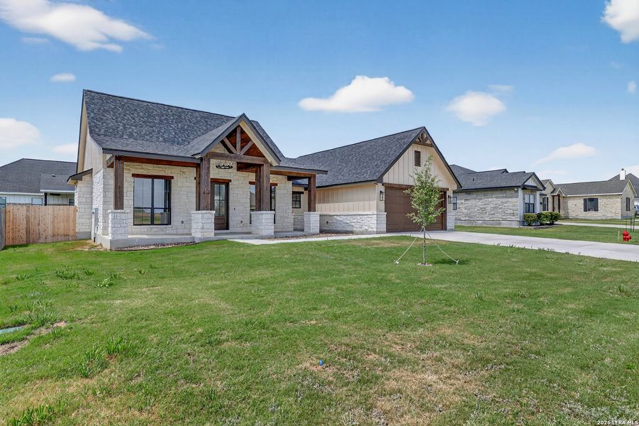 Front exterior of a new home in , Poth, TX, highlighting curb appeal (Image 24).