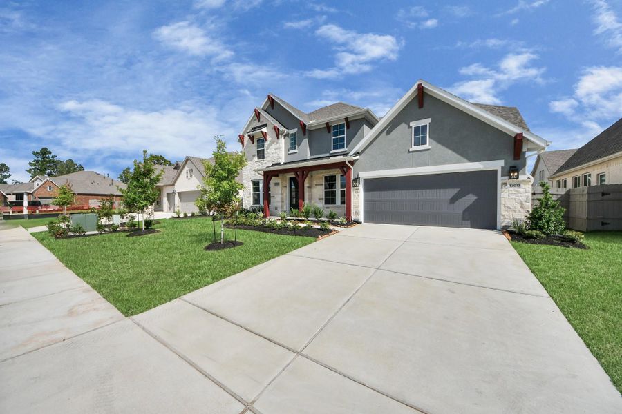 Front exterior of a new home in ARTAVIA: Hilltop Collection, Conroe, TX, highlighting curb appeal (Image 19). Front exterior of a new home in ARTAVIA: Hilltop Collection, Conroe, TX, highlighting curb appeal (Image 19).