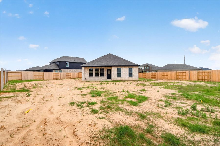 Exterior details and patio area of a home in Sunterra, Katy (Image 28).
