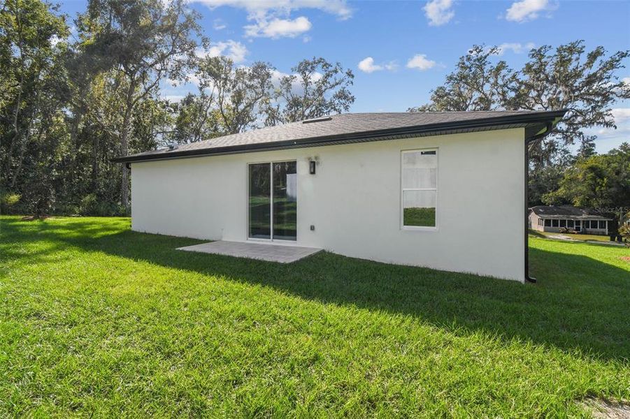 Exterior details and patio area of a home in , Brooksville (Image 33).