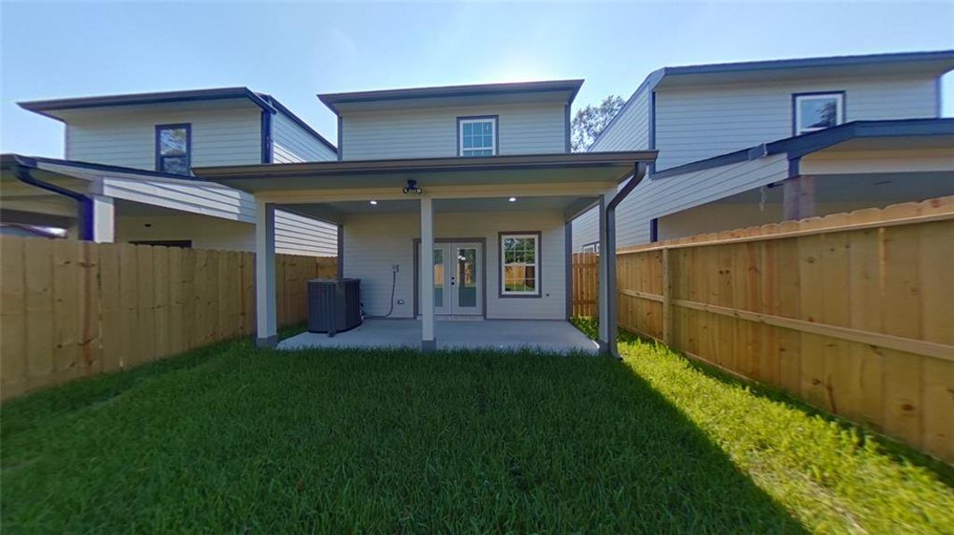 7918 James Franklin St fully fenced manicured backyard.