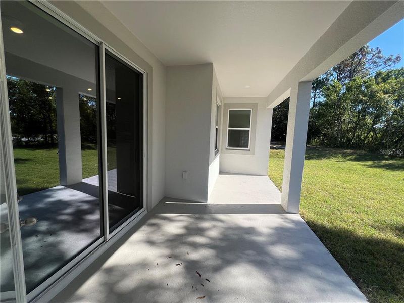 Exterior details and patio area of a home in Palm Coast: Cornerstone Collection, Palm Coast (Image 20).