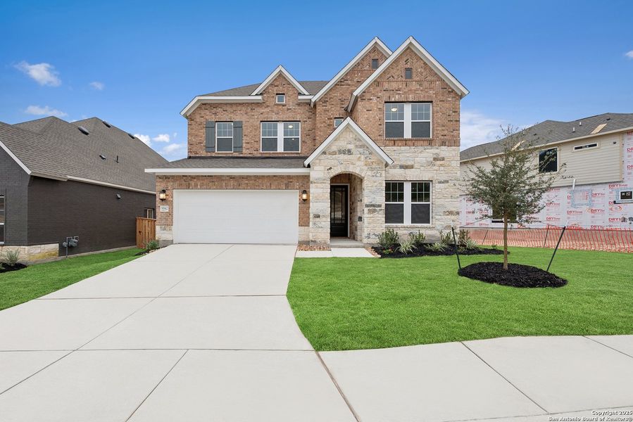 Front exterior of a new home in Windsong - Reserve Series, Boerne, TX, highlighting curb appeal (Image 22). Front exterior of a new home in Windsong - Reserve Series, Boerne, TX, highlighting curb appeal (Image 22).