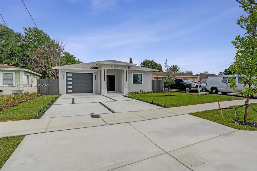 Front exterior of a new home in , West Park, FL, highlighting curb appeal (Image 27).
