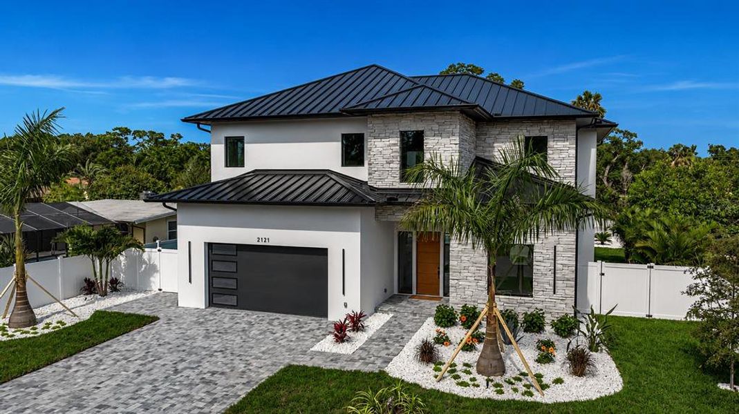 Front exterior of a new home in , Sarasota, FL, highlighting curb appeal (Image 24).