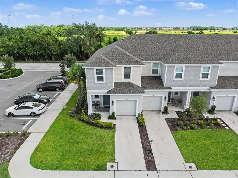 Front exterior of a new home in , St. Cloud, FL, highlighting curb appeal (Image 24).