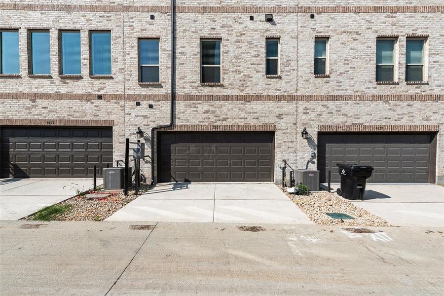 Front exterior of a new home in Wade Settlement Townhomes, Frisco, TX, highlighting curb appeal (Image 2).