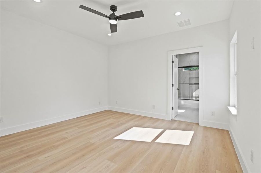 Empty room with light wood-style flooring, recessed lighting, and a ceiling fan