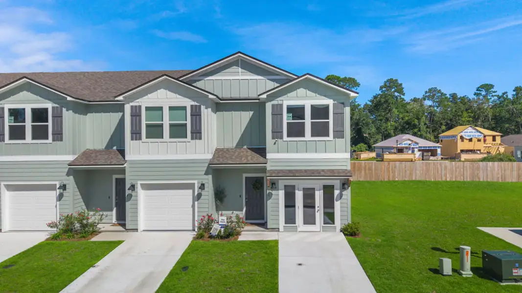 Front exterior of a new home in Horseman's Bluff, Tallahassee, FL, highlighting curb appeal (Image 1). Front exterior of a new home in Horseman's Bluff, Tallahassee, FL, highlighting curb appeal (Image 1).