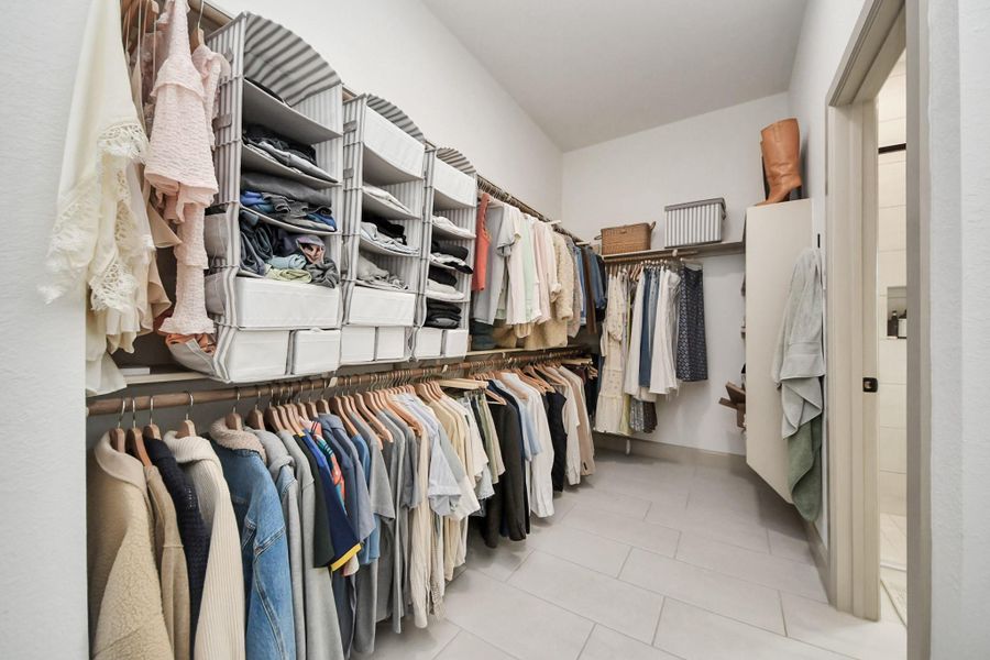 Spacious primary closet offers ample room for sharing, ensuring an organized and stylish start to your day.