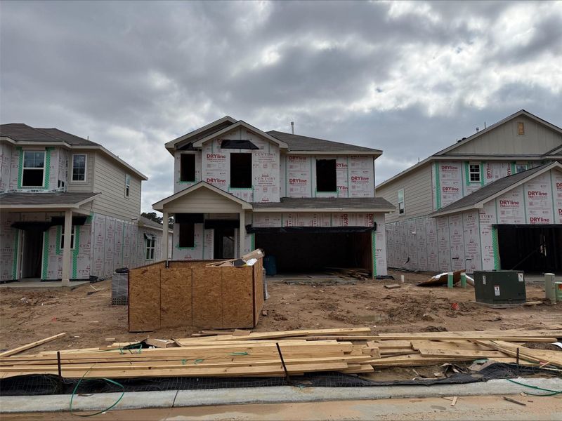 In-progress construction of a new home in The Lakes at Black Oak Villas, Magnolia, TX (Image 24).