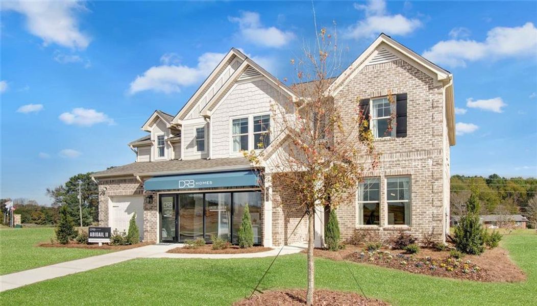 Front exterior of a new home in Adagio, Dacula, GA, highlighting curb appeal (Image 1).