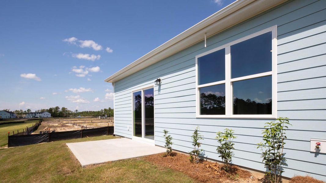 Exterior details and patio area of a home in Indigo Preserve Townhomes, Leland (Image 2).