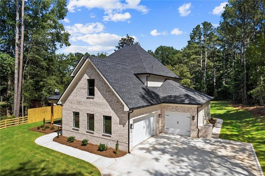 Front exterior of a new home in , Winder, GA, highlighting curb appeal (Image 2). Front exterior of a new home in , Winder, GA, highlighting curb appeal (Image 2).