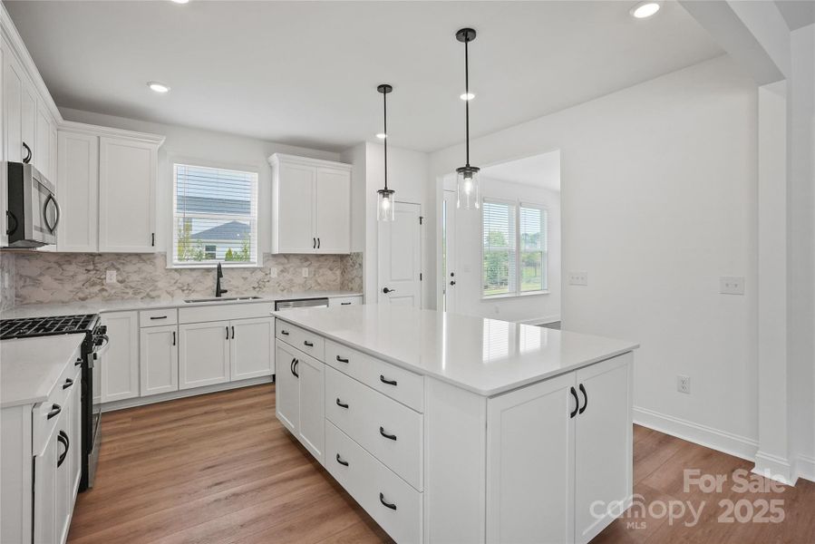 Modern kitchen overlooking sunroom