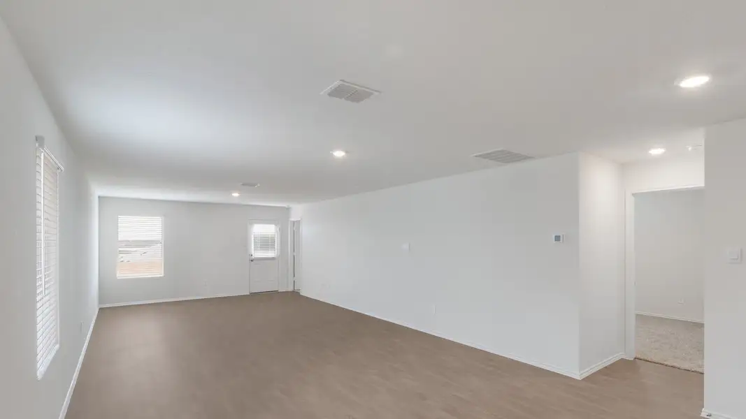 Representative unfurnished interior of a home built from the The Estero by D.R. Horton in Watermill, Uhland (Image 7).
