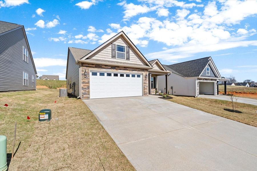 Representative exterior photo of a completed home built from the Wellford by Enchanted Homes in Hampshire Heights, Moore, SC (Image 21).