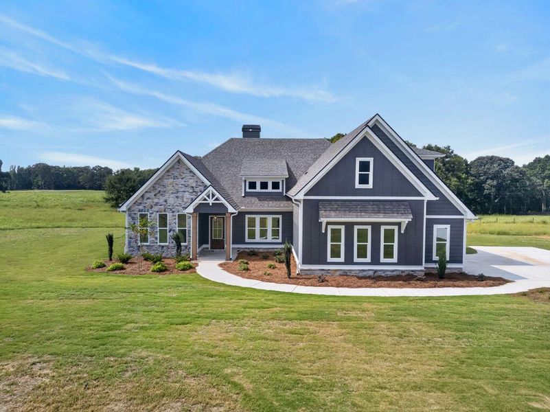 Front exterior of a new home in Veal Meadows, Roopville, GA, highlighting curb appeal (Image 31). Front exterior of a new home in Veal Meadows, Roopville, GA, highlighting curb appeal (Image 31).