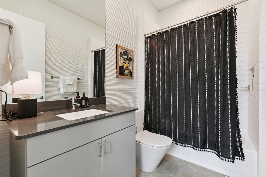 Bathroom with vanity and shower / bath combo