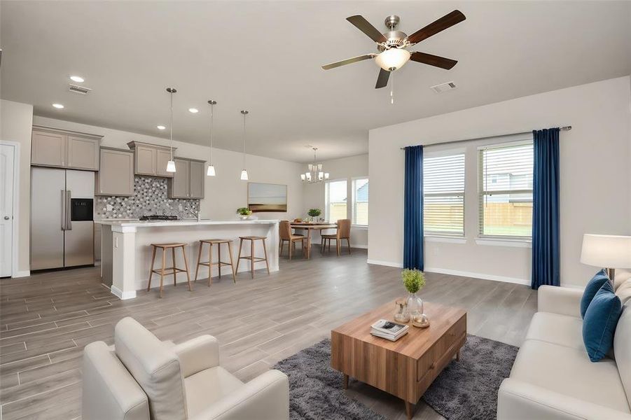 Another view of the open floor plan, perfect for entertaining guests or a quiet day in with the family **This image is from another Saratoga Home with similar floor plan and finishes, not the Brittany floorplan.**