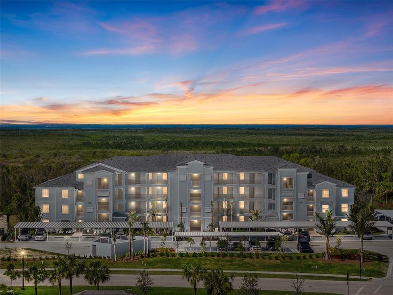 Front exterior of a new home in Heritage Landing: Veranda Condominiums, Punta Gorda, FL, highlighting curb appeal (Image 27).