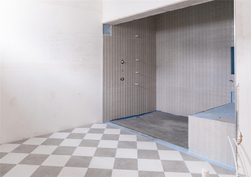 Primary Bathroom tile on Unit B/C. Progress as of 4/15/26.