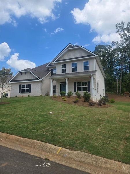 Front exterior of a new home in Mirror Lake at South Harbour, Villa Rica, GA, highlighting curb appeal (Image 1).