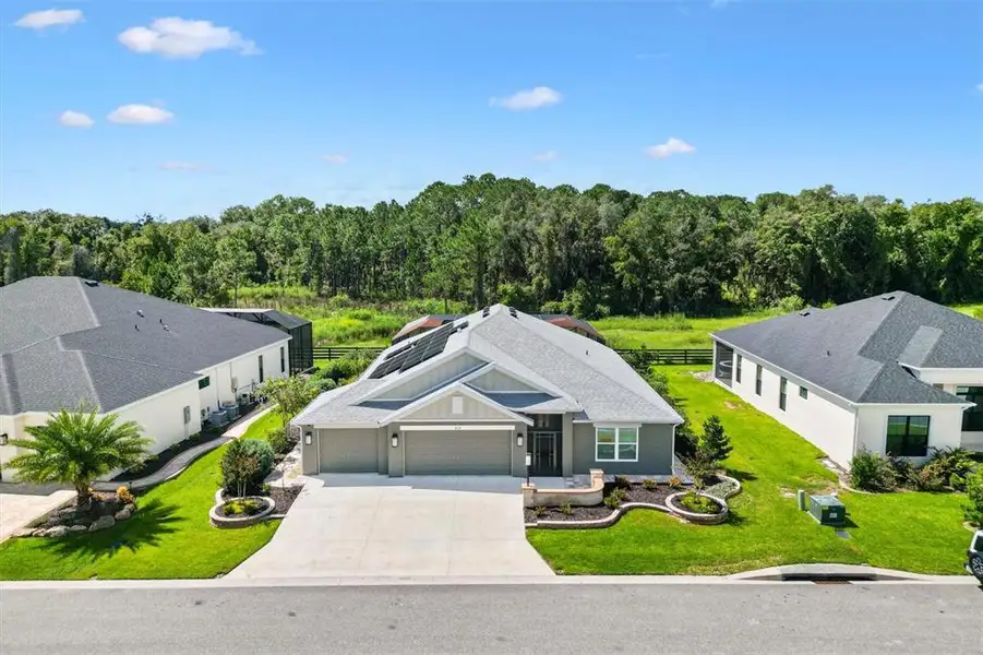 Front exterior of a new home in , The Villages, FL, highlighting curb appeal (Image 24).