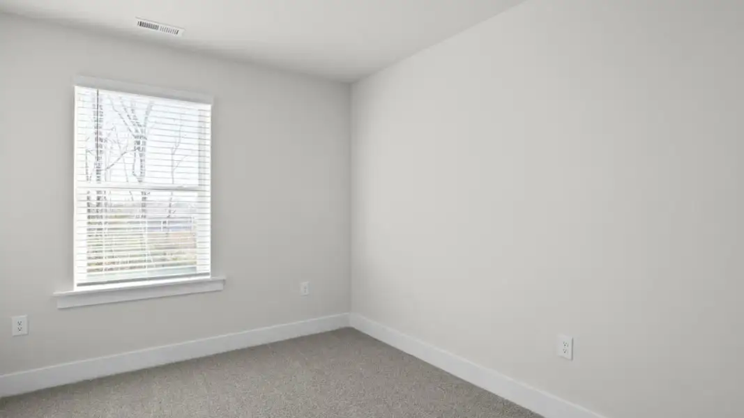 Spacious, unfurnished interior of a new home in The Townes at Cedar Hill Landing, Navassa (Image 25).