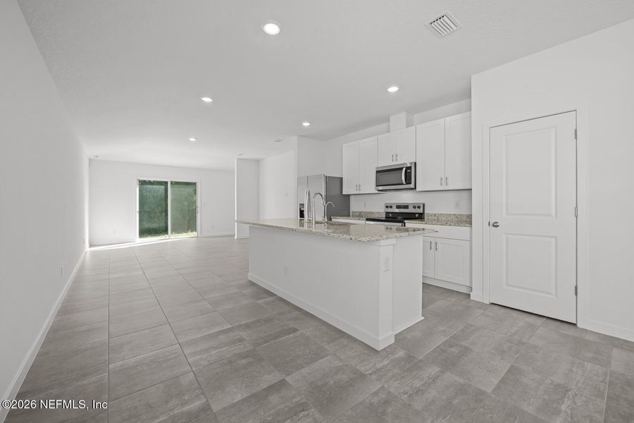 Furnished interior view inside a new home in Lakes at Bella Lago – Classic Series, Green Cove Springs (Image 7).