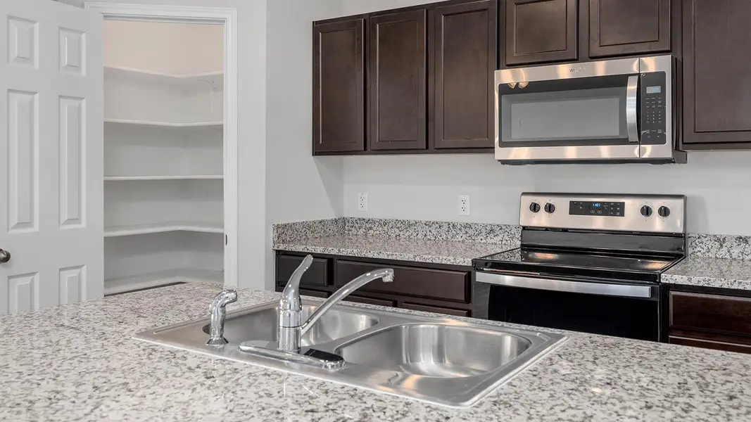Furnished interior view inside a new home in Victory Ranch, Killeen (Image 12).
