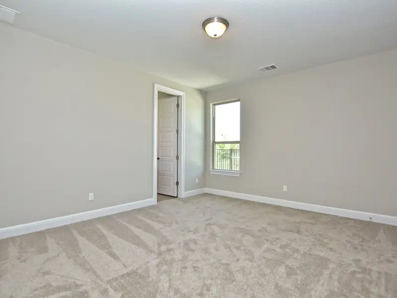 Representative unfurnished interior of a home built from the Santa Barbara II by Giddens Homes in Scofield Farms Estates, Georgetown (Image 112).
