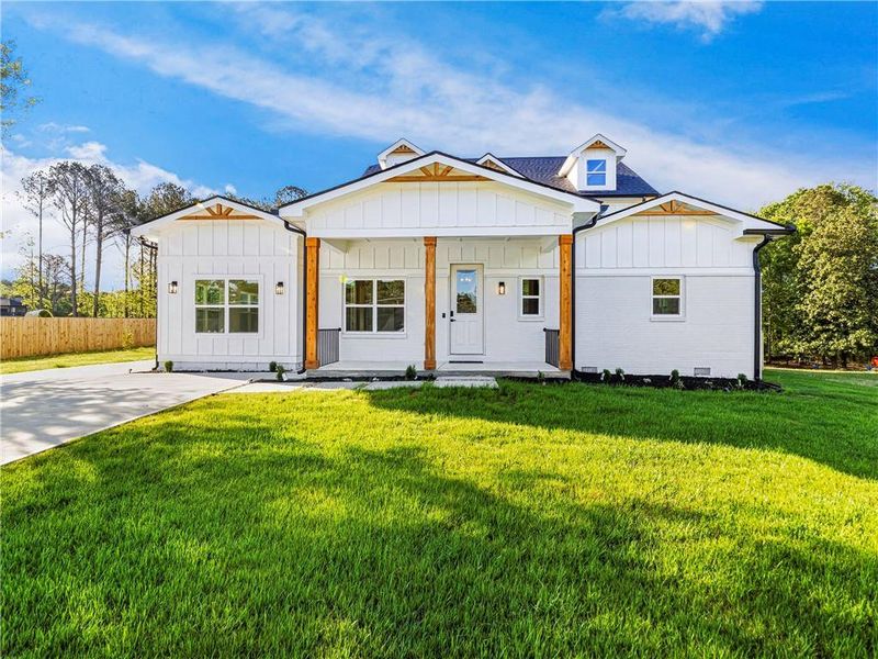 Front exterior of a new home in , Loganville, GA, highlighting curb appeal (Image 23).