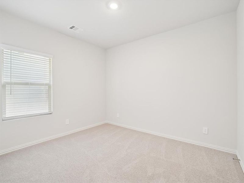 Unfurnished room with light carpet and baseboards