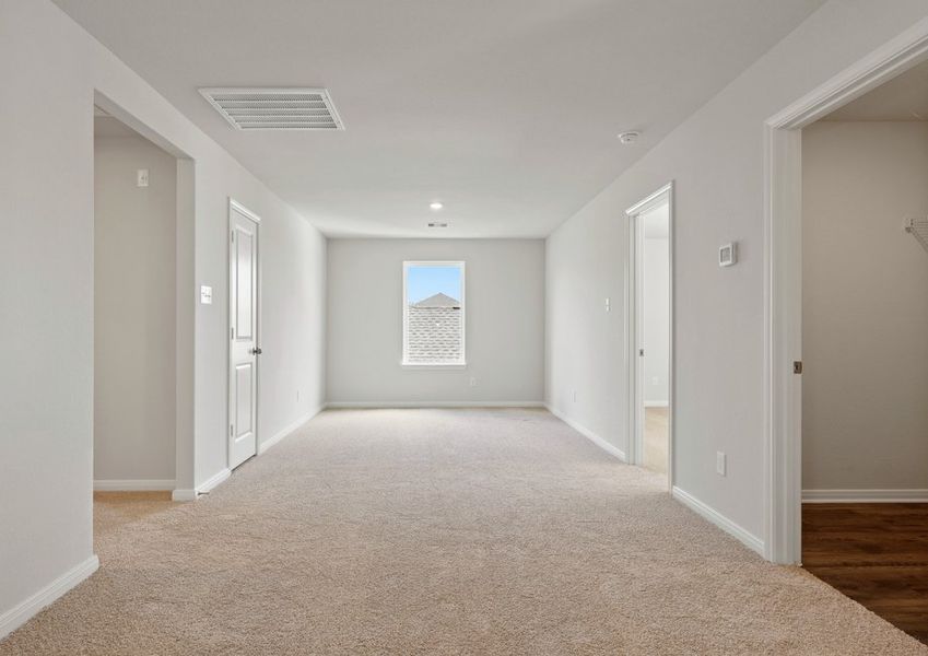 Upstairs gmae room with lush carpet flooring Upstairs gmae room with lush carpet flooring