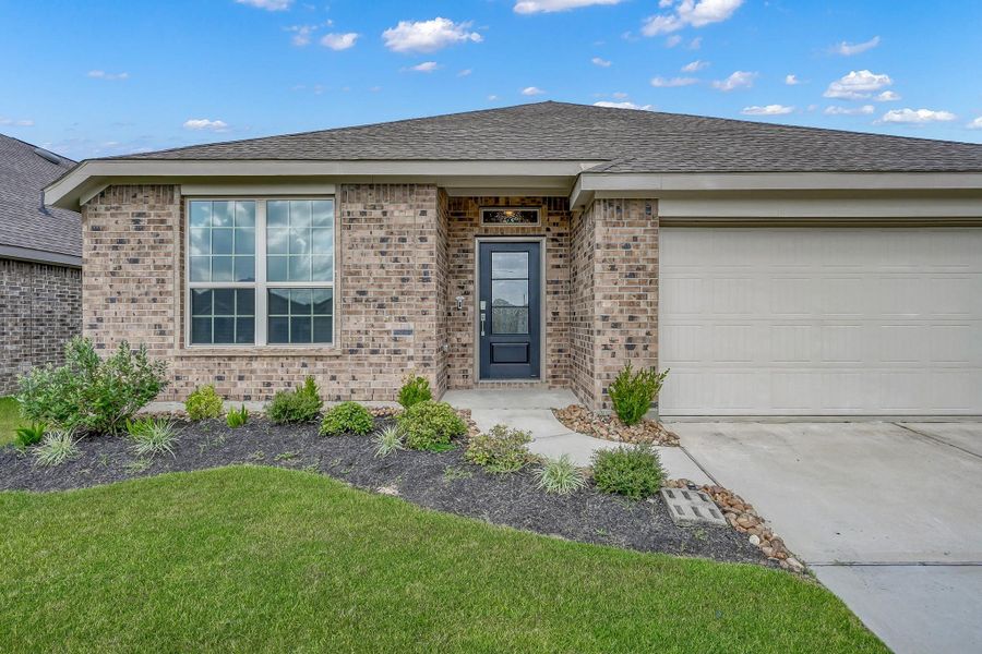 Front exterior of a new home in Tavola: Wildflower II Collection, New Caney, TX, highlighting curb appeal (Image 2).