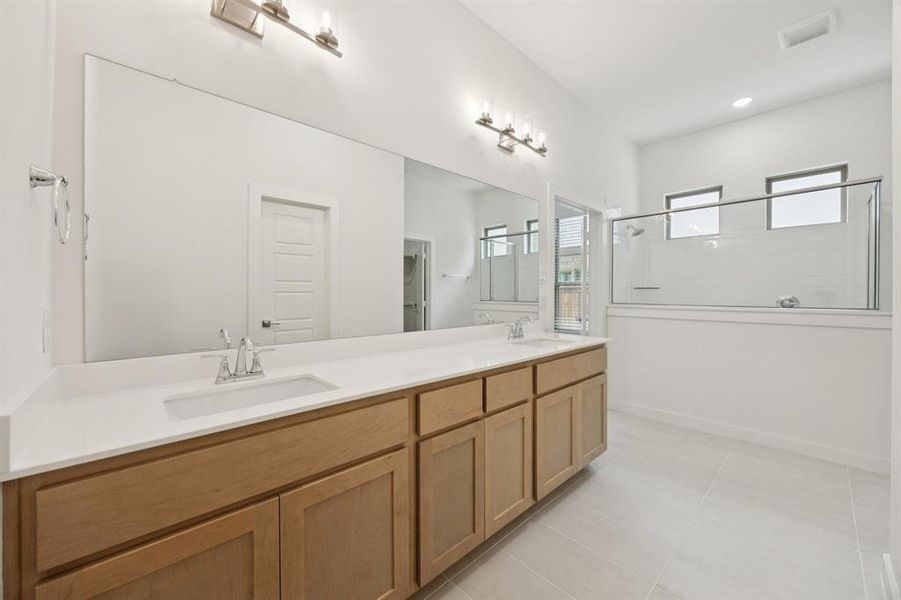 Primary Bathroom in the Monet II home plan by Trophy Signature Homes – REPRESENTATIVE PHOTO
