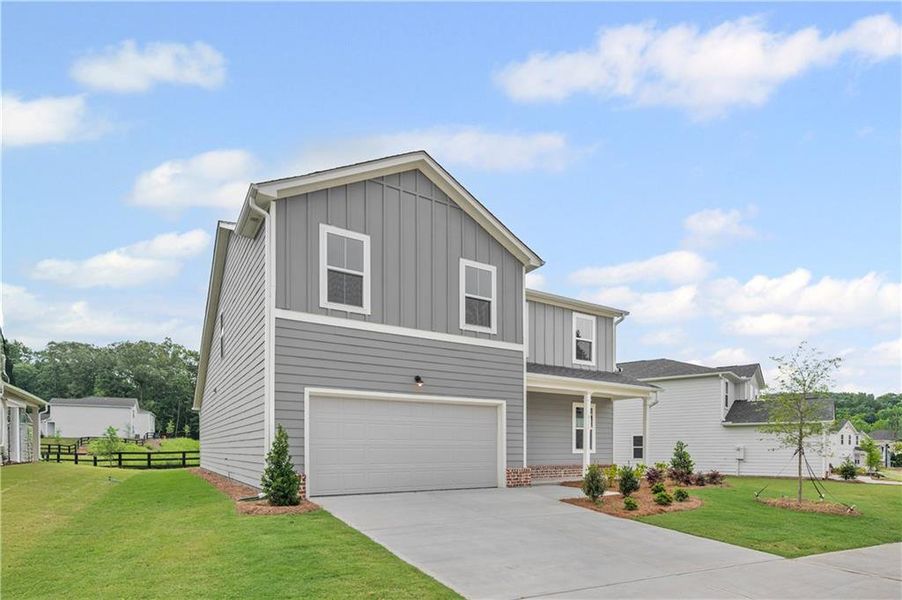 Front exterior of a new home in Avery Ridge, Gainesville, GA, highlighting curb appeal (Image 1).