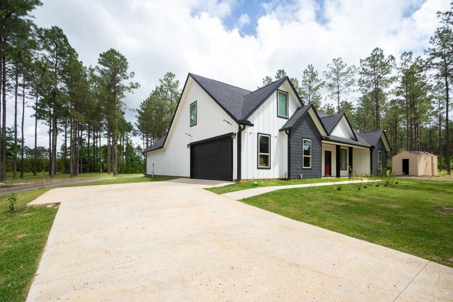 Front exterior of a new home in , Livingston, TX, highlighting curb appeal (Image 28).