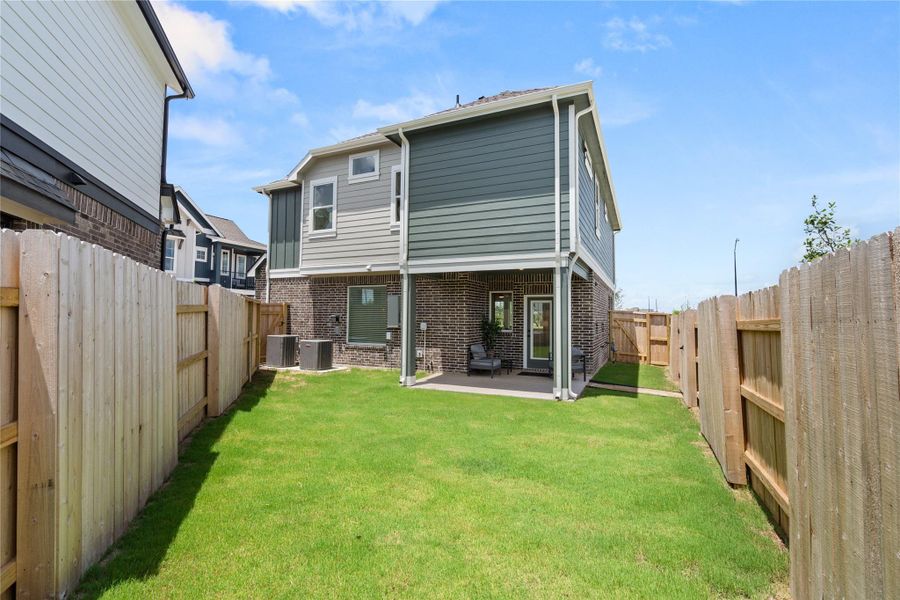 Exterior details and patio area of a home in Elyson, Katy (Image 4).