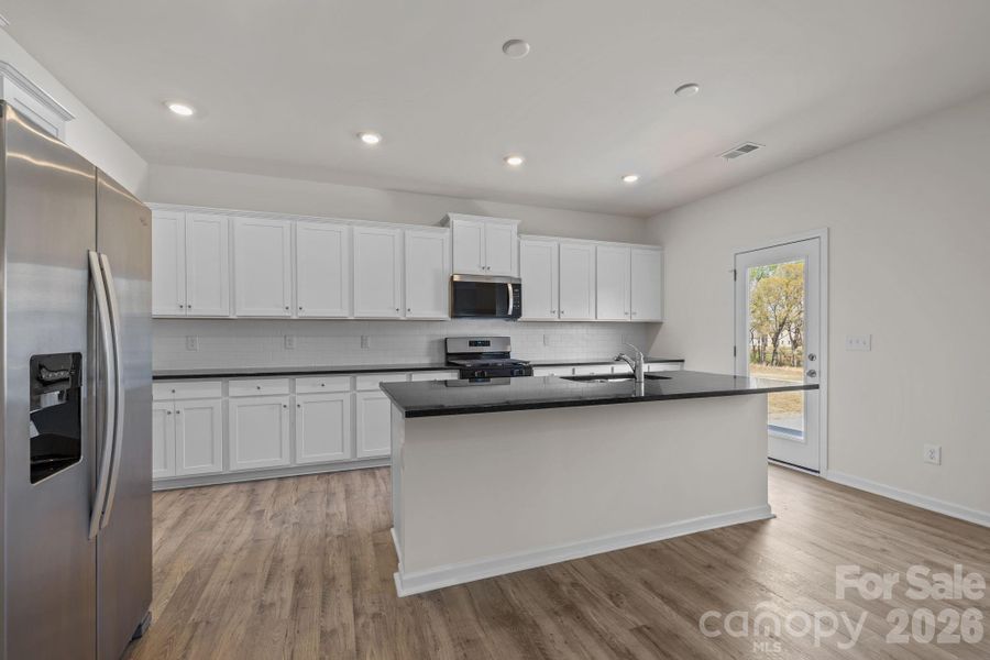 Furnished interior view inside a new home in McFarland Estates, York (Image 10).