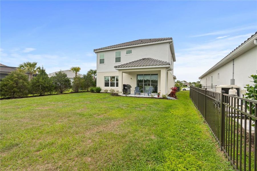 Exterior details and patio area of a home in , Sarasota (Image 35).