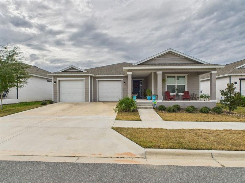 Front exterior of a new home in Calesa Township, Ocala, FL, highlighting curb appeal (Image 2).
