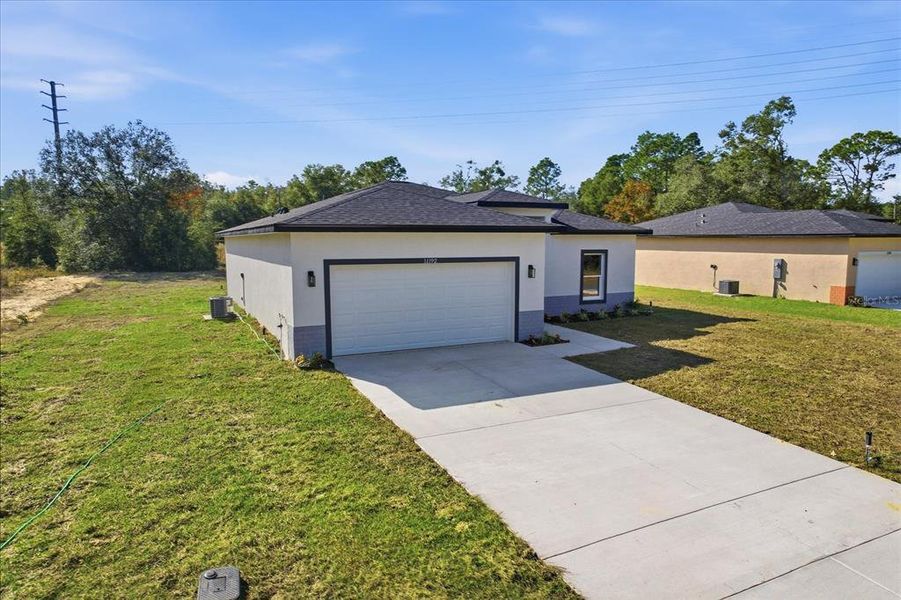 Front exterior of a new home in , Citrus Springs, FL, highlighting curb appeal (Image 20).