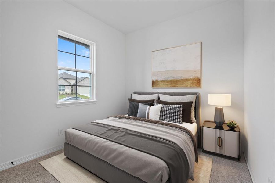 Your secondary bedroom features plush carpet, fresh paint, closet, and a large window that lets in plenty of natural lighting.