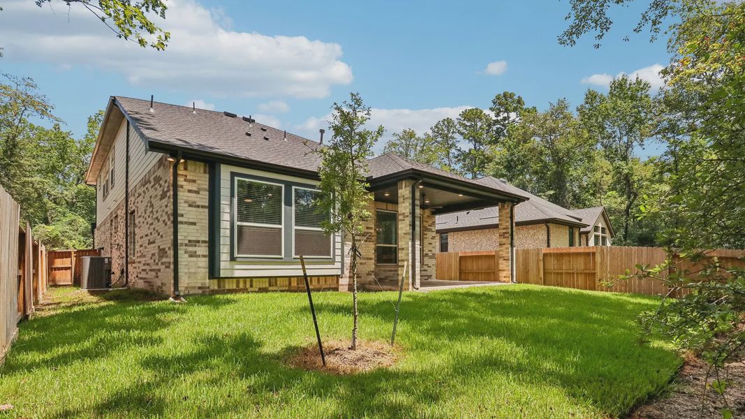 Exterior details and patio area of a home in The Woodland Hills 50', Willis (Image 23). Exterior details and patio area of a home in The Woodland Hills 50', Willis (Image 23).