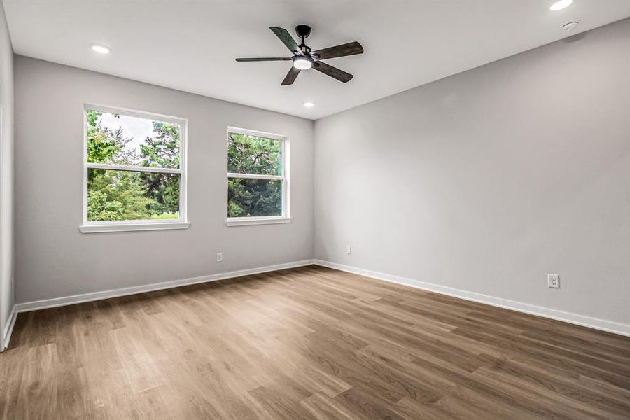 Two large windows overlook the green space in the back of the home and provide plenty of natural light.