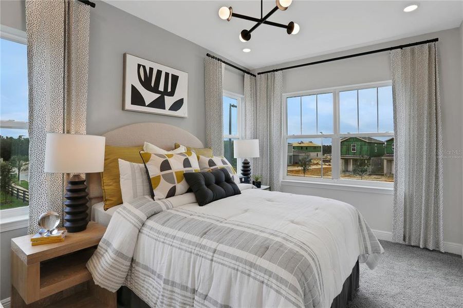 Furnished interior view inside a new home in Serenade at Ovation, Winter Garden (Image 18).